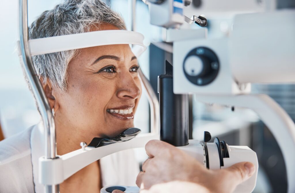 A mature woman undergoes an eye exam.