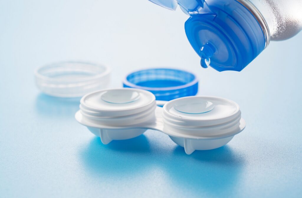 Custom contact lenses resting in a case filled with contact lens solution.