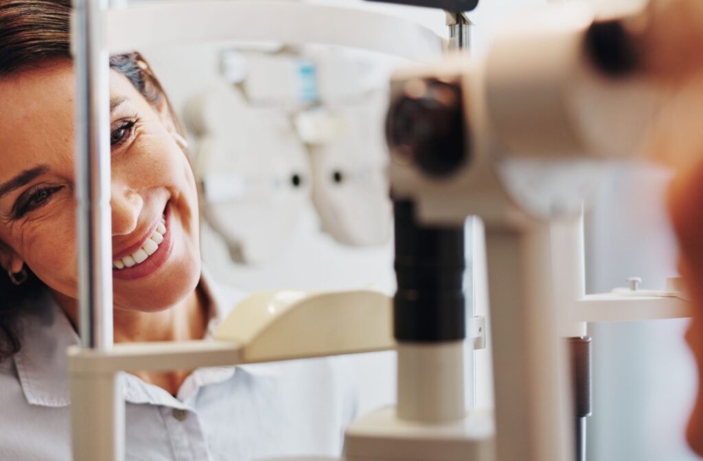 An eye doctor assessing a patient's eyes for the affects of high cholesterol on vision.